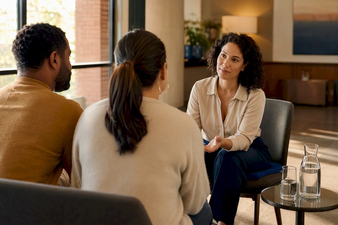 Mixed couples questioning a support group organizer