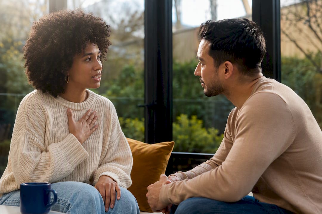 Mixed couple practicing calm I-statement conversation